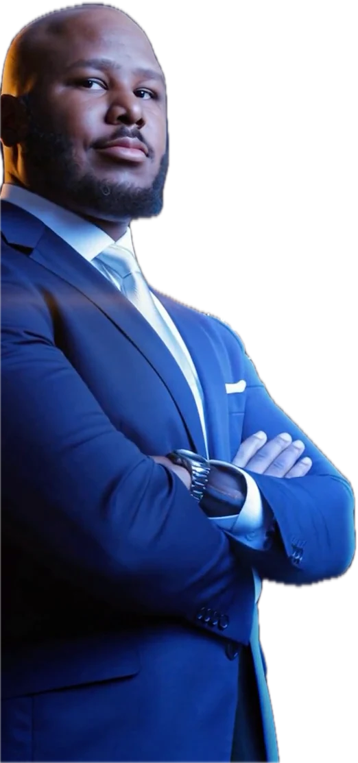 Aayrrick Thomas in a navy suit, arms crossed